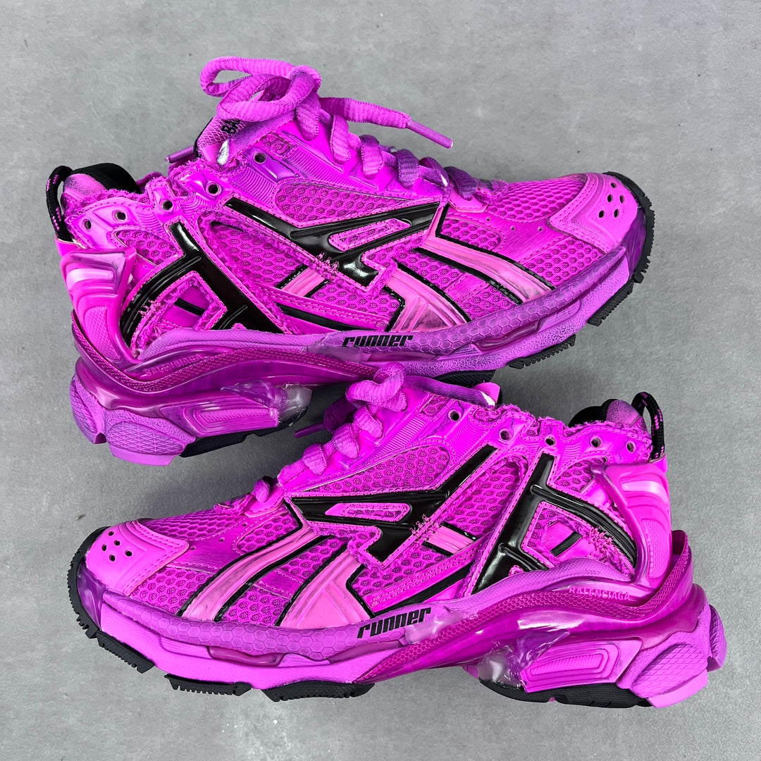 Balenciaga running sneakers in bright pink with black side stripes and lace-up design