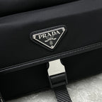Prada black crossbody bag with triangular logo plaque on flap
