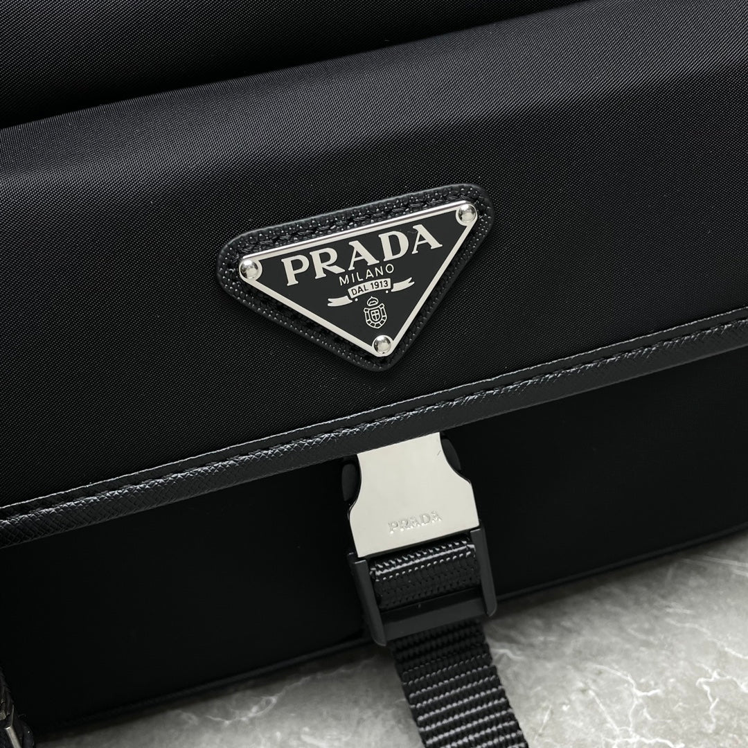 Prada black crossbody bag with triangular logo plaque on flap