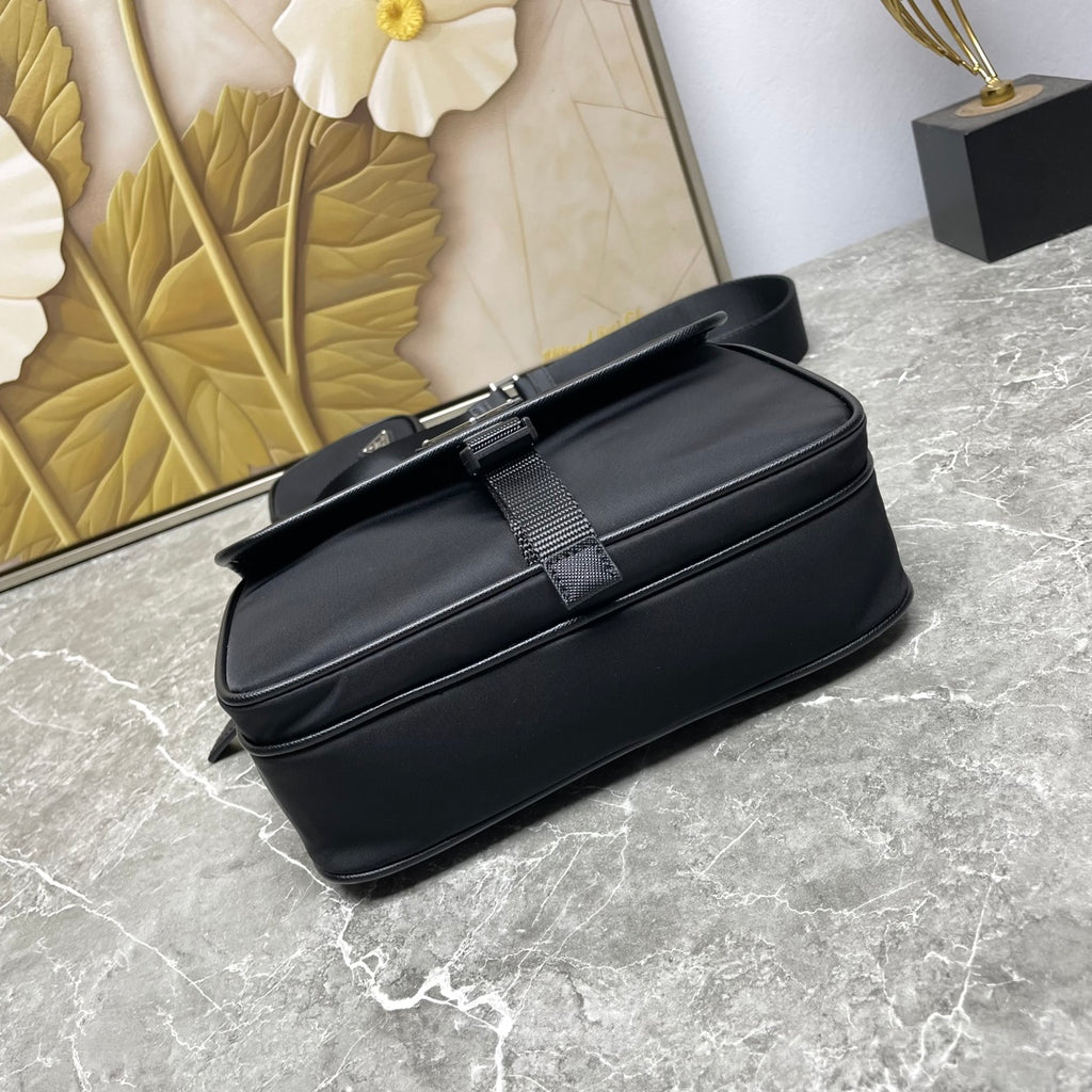 Prada black crossbody bag with front buckle strap detail