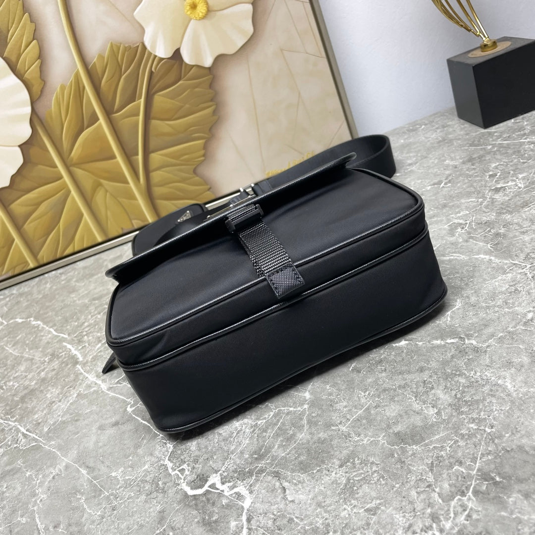 Prada black crossbody bag with front buckle strap detail