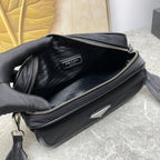Prada black crossbody bag interior with zipper opening and logo patch