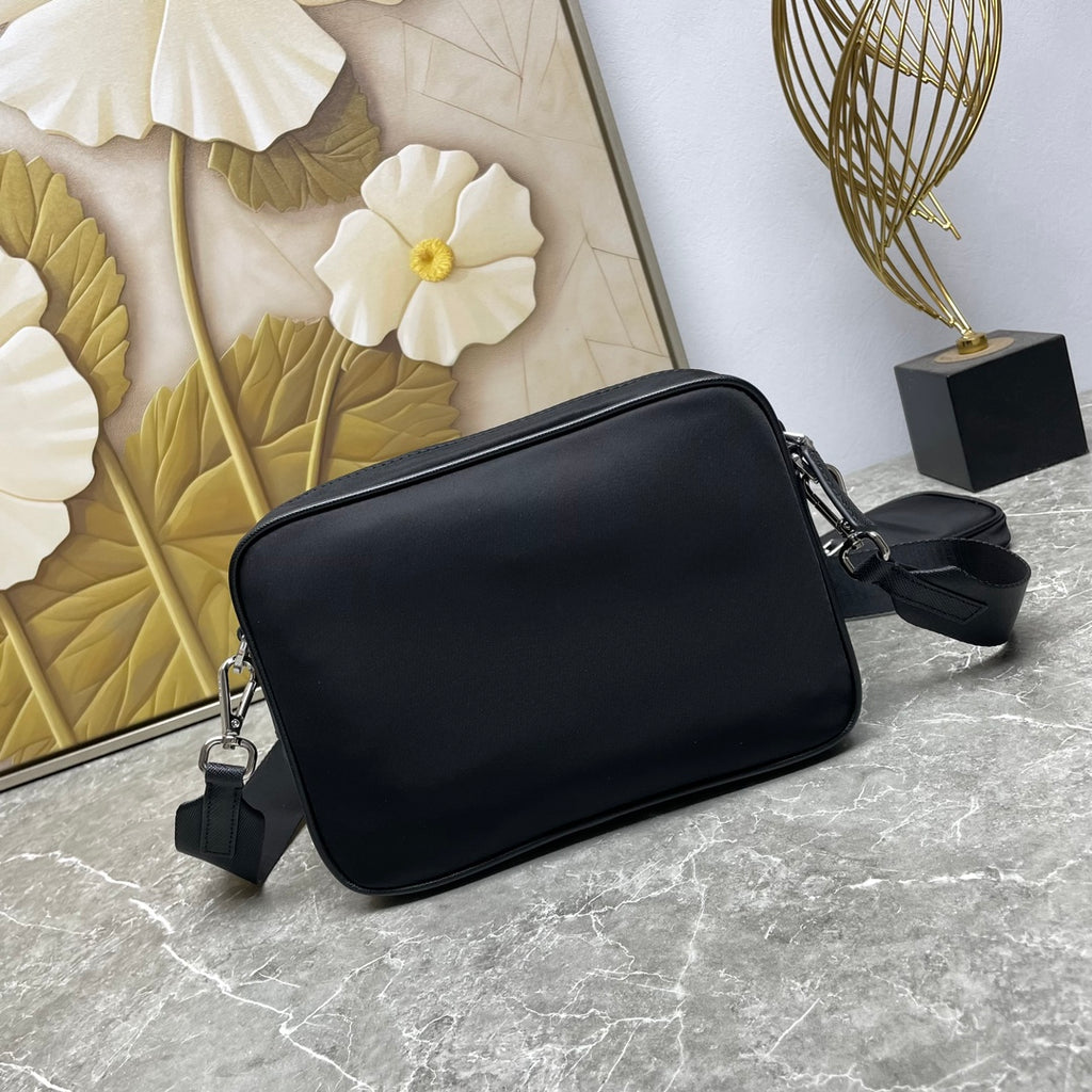 Prada black crossbody bag with smooth finish and adjustable strap