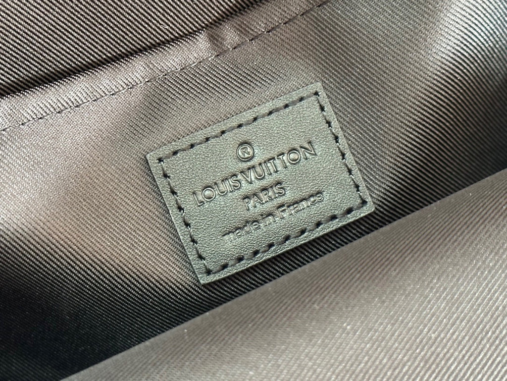 Louis Vuitton fabric tag reading 'Louis Vuitton Paris' on bag lining