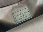 Louis Vuitton fabric tag reading 'Louis Vuitton Paris' on bag lining