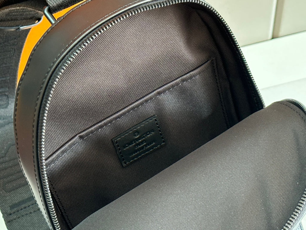 Louis Vuitton bag interior pocket with embossed LV logo on dark leather lining
