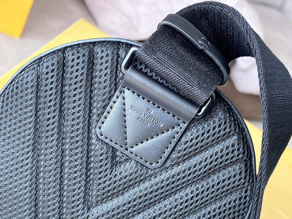 Louis Vuitton small bag with textured gray fabric, stitched label patch, and adjustable strap