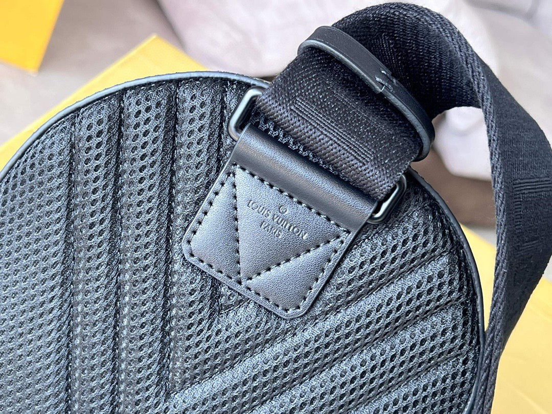 Louis Vuitton small bag with textured gray fabric, stitched label patch, and adjustable strap
