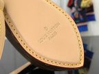 Louis Vuitton interior leather label with “Louis Vuitton Paris” text and tan edge stitching