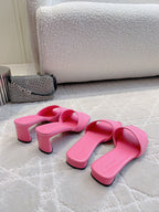 Red-pink Balenciaga slide sandals with low block heels and open toe