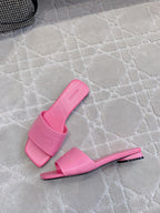 Pink Balenciaga slide sandals with curved footbed and low block heel