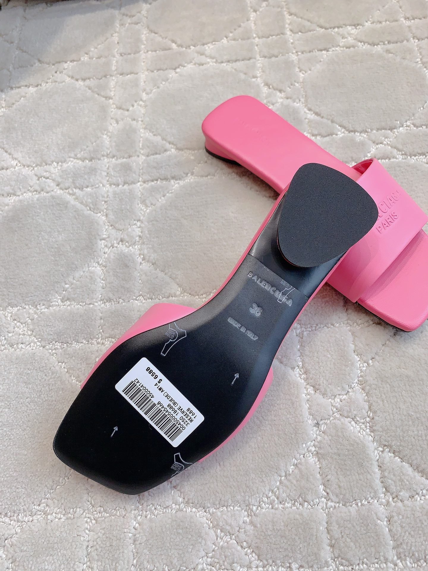 Pink Balenciaga slide sandal with black insole and size label