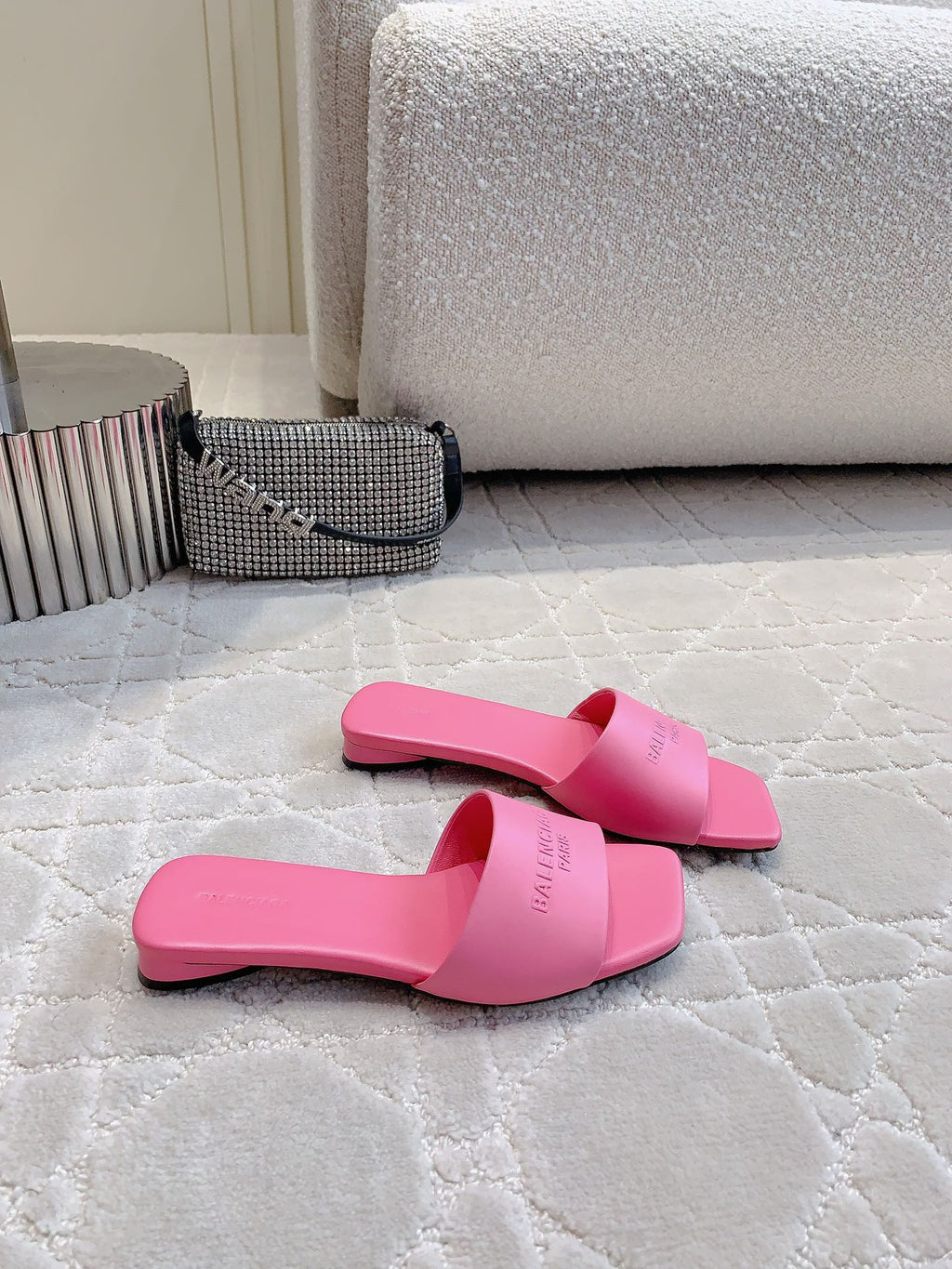 Pink Balenciaga slide sandals with low heel, side view