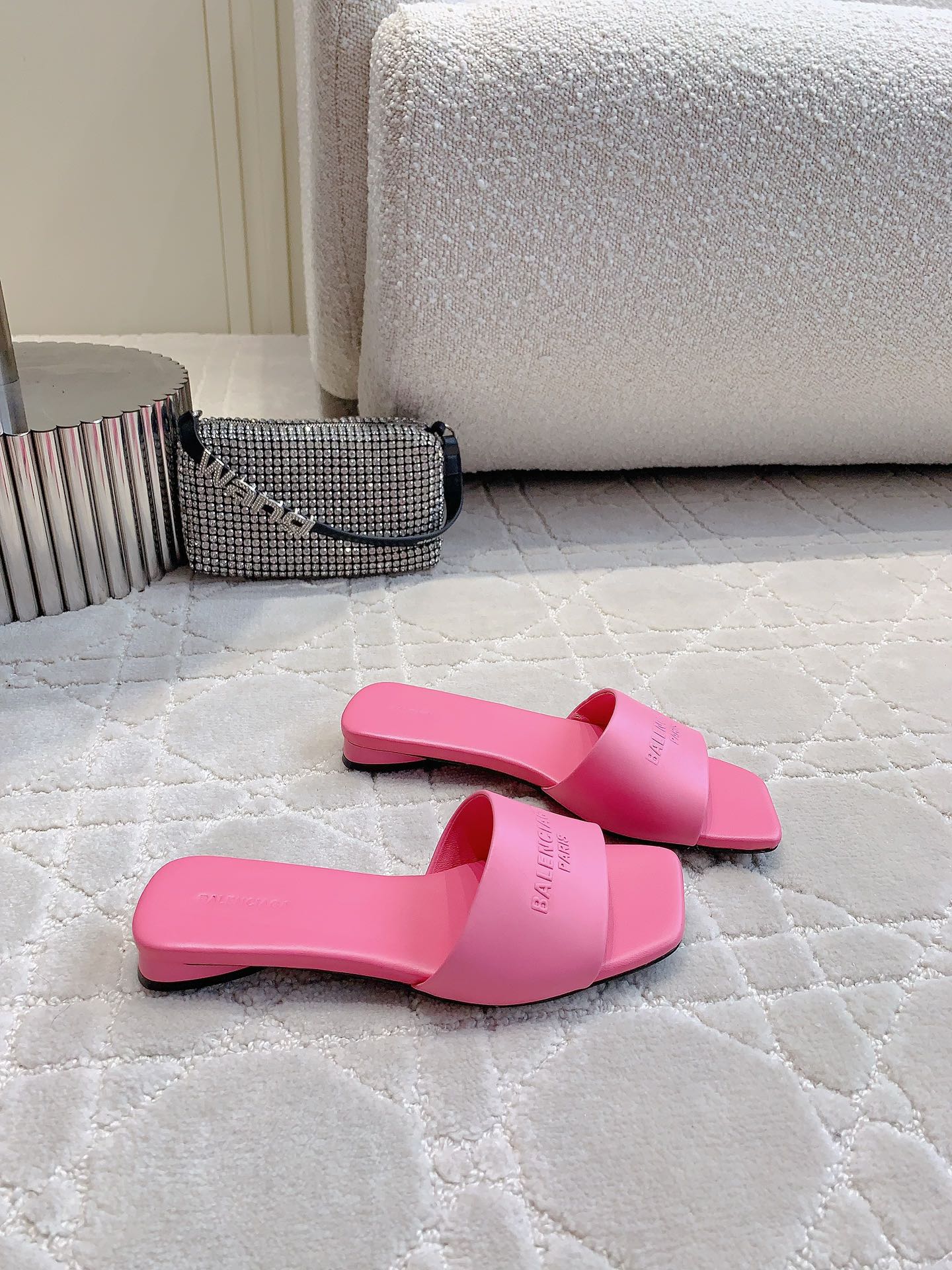 Pink Balenciaga slide sandals with low heel, side view