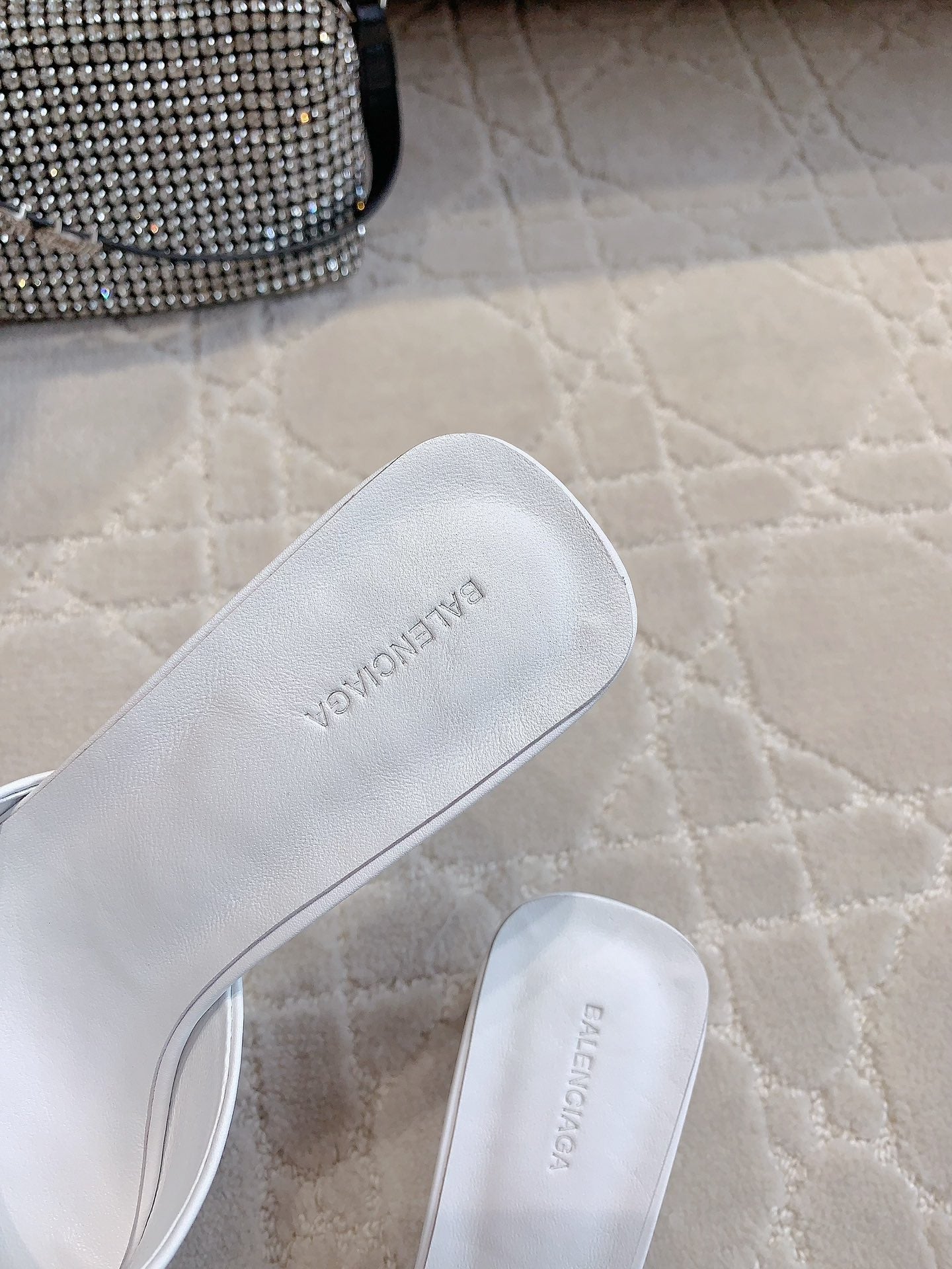 Balenciaga white slide sandals with BALENCIAGA text on footbed
