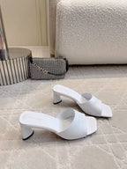 Balenciaga white mules with slim strap and black block heel