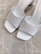 Balenciaga white sandals with embossed logo on side strap