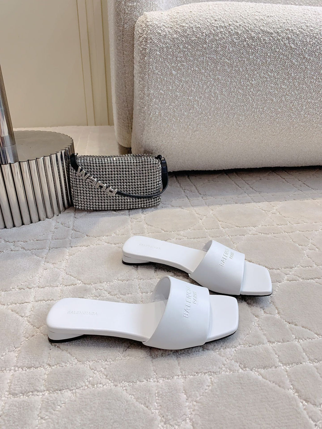 White Balenciaga slide sandals with thick flat sole and wide crossover straps
