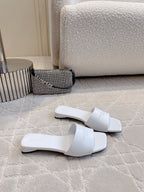 White Balenciaga slide sandals with thick flat sole and wide crossover straps