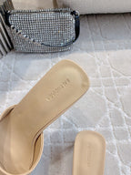 Beige slide sandal footbed with BALENCIAGA branding, close-up