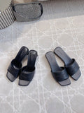 Balenciaga slide sandals, dark leather-look with wide strap and cushioned footbed