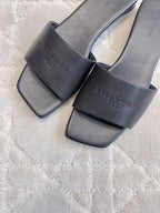 Balenciaga slide sandals, dark leather-look with engraved logo on upper and strap