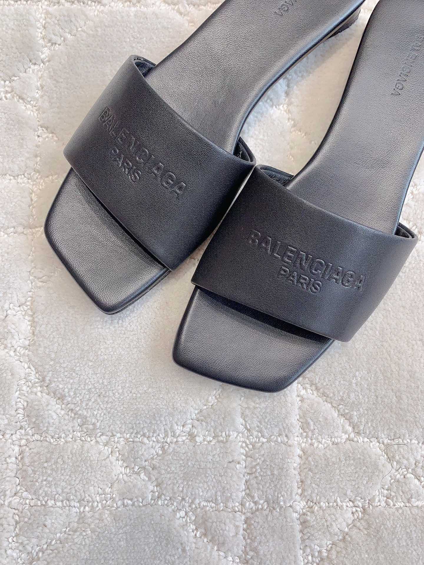Balenciaga slide sandals, dark leather-look with engraved logo on upper and strap
