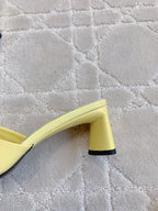 Yellow mule sandal side view with thick block heel