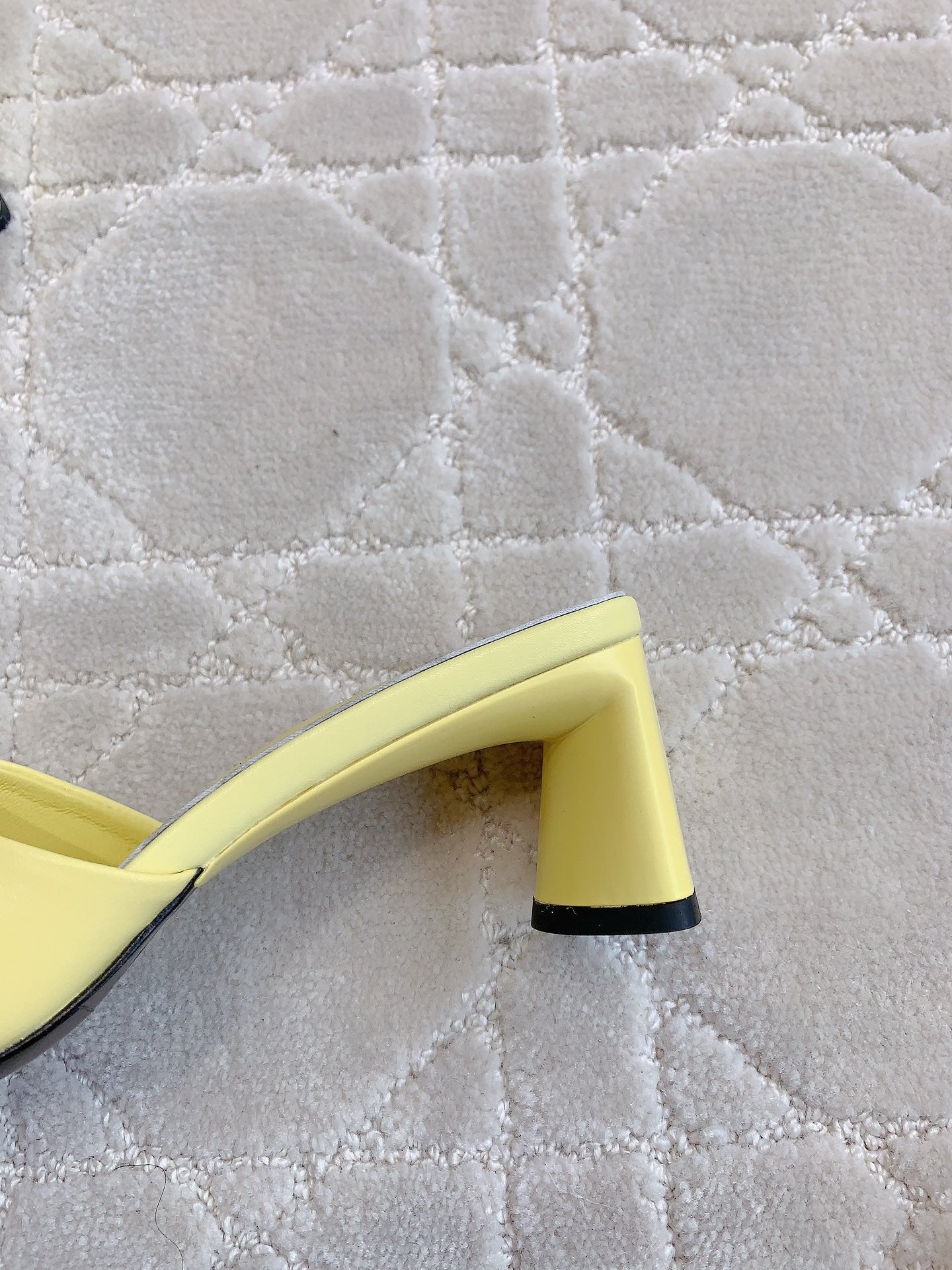 Yellow mule sandal side view with thick block heel