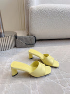 Yellow mule sandals with open back and thick block heels