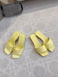 Yellow leather slide sandals with square toe and wide block heel