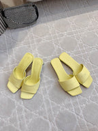 Yellow leather slide sandals with square toe and wide block heel