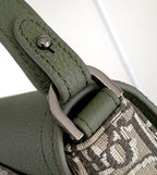 Olive green leather bag strap end with dark metal buckle and stitched detailing
