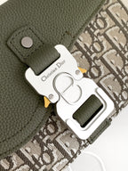 Close-up of olive green leather bag clasp with Dior-branded metal hardware