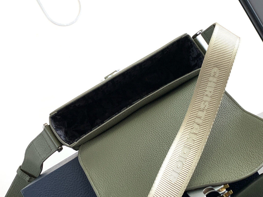 Mini bag with open top showing dark interior and beige webbing shoulder strap