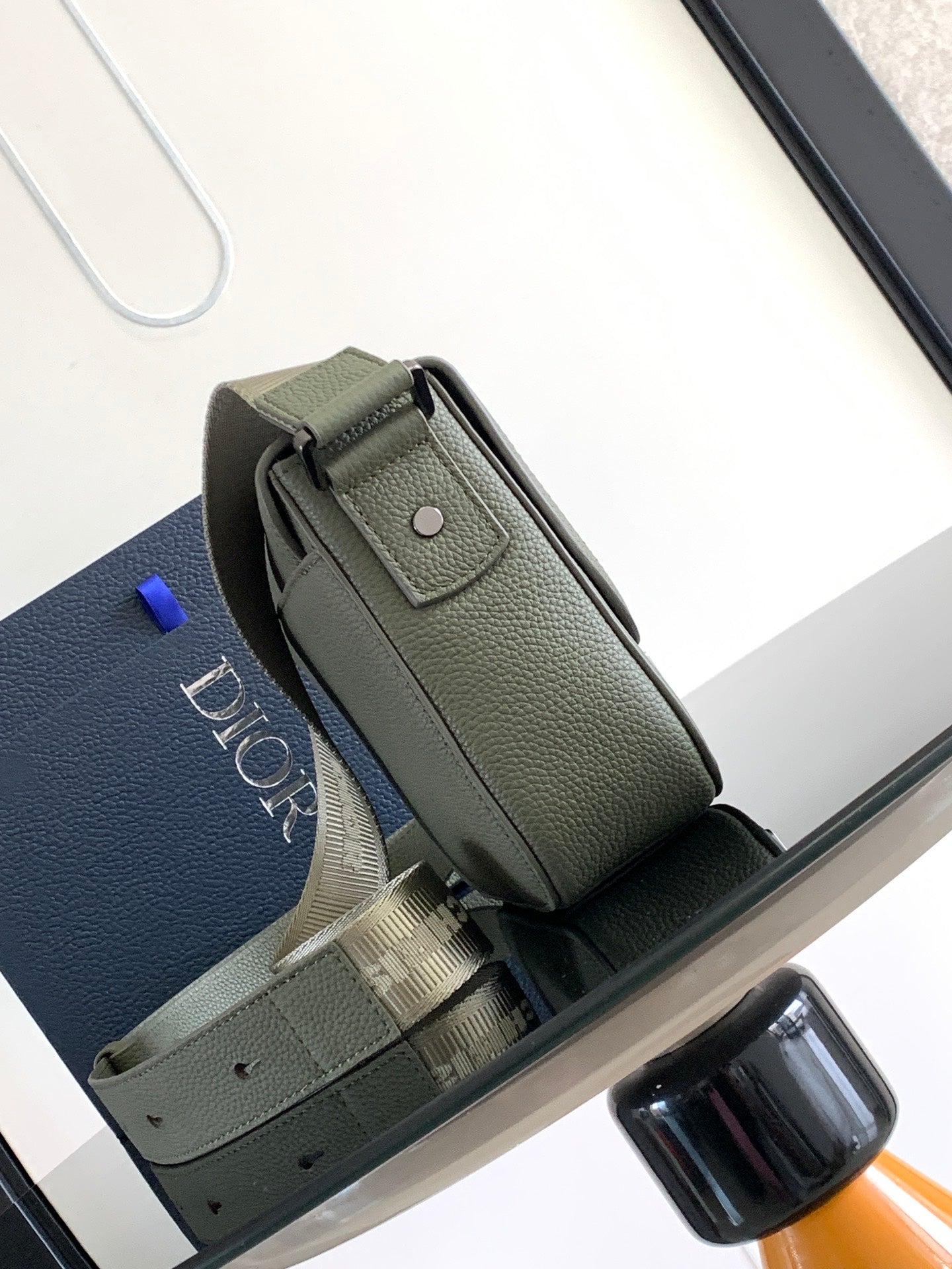 Dior men’s green leather bag with top handle and front flap clasp hardware