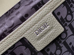 Printed lining with Dior logo patch on light leather tab