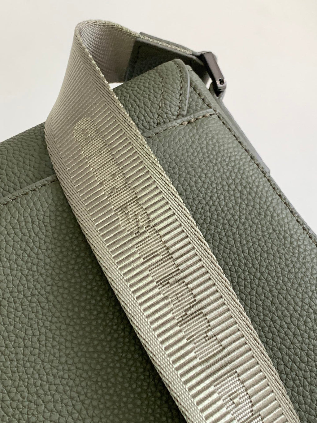 Dior green bag with textured webbing strap and stitching