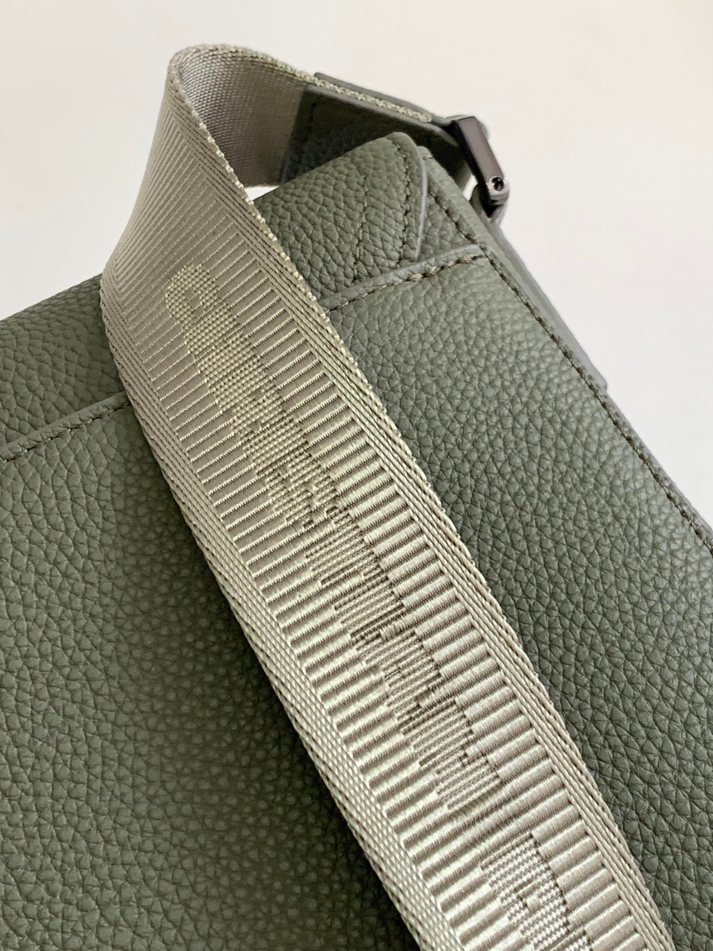 Dior green bag with textured webbing strap and stitching