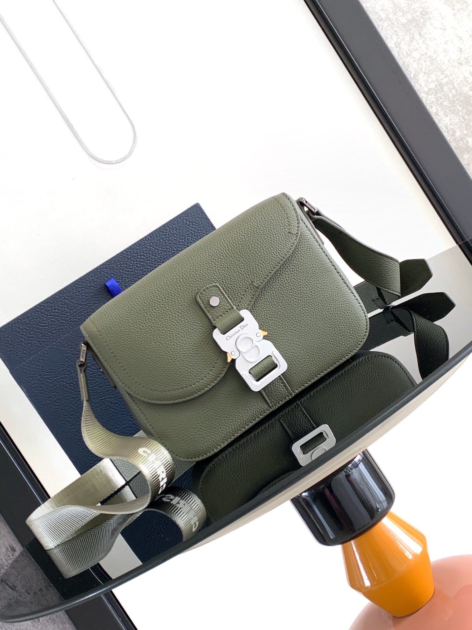 Dior men’s green leather shoulder bag with front flap and strap hardware