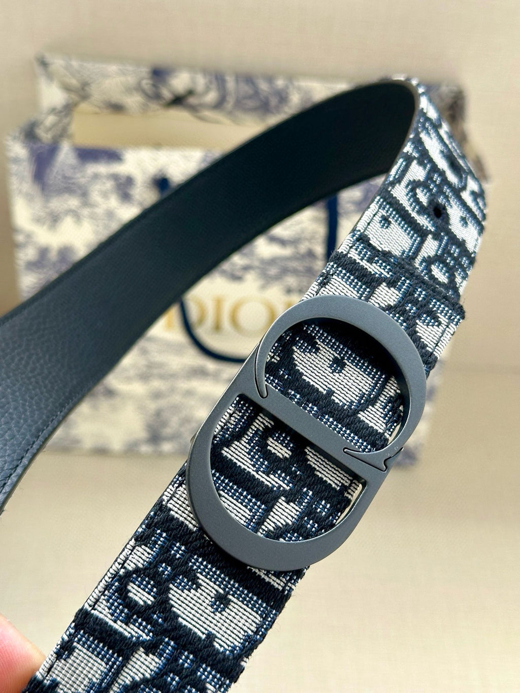 Dior monogram belt with navy patterned strap and silver-tone oval buckle