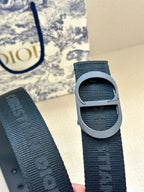 Dark blue belt strap detail with gray buckle and textured woven design