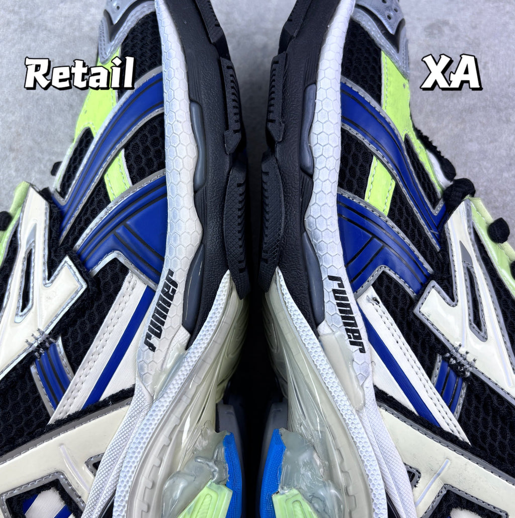 Balenciaga sneakers interior view, black-and-white upper with blue accents and laced opening