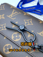 Louis Vuitton monogram bag clasp and dark leather strap with metal ring