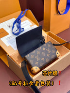 Louis Vuitton monogram crossbody bag with navy interior flap and dark shoulder strap