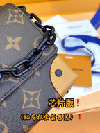 Louis Vuitton monogram bag chain link hardware and tan leather tab