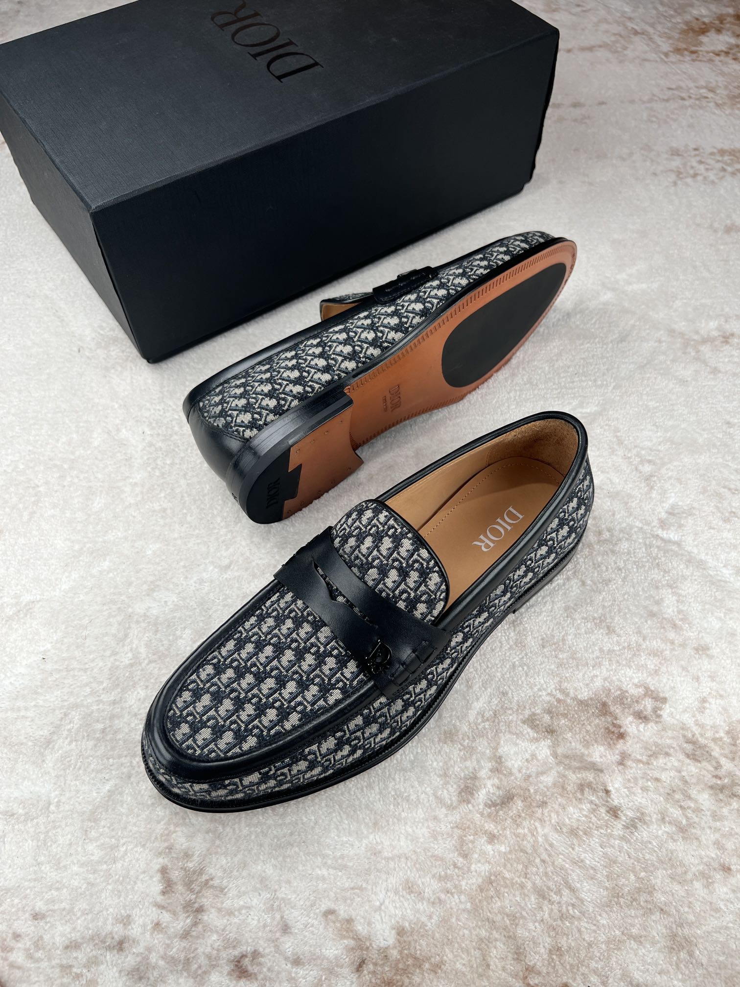 Dior unisex logo-print loafers, soles and side profile with dark leather-look