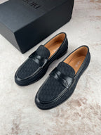Black Dior unisex loafers pair with strap and textured finish