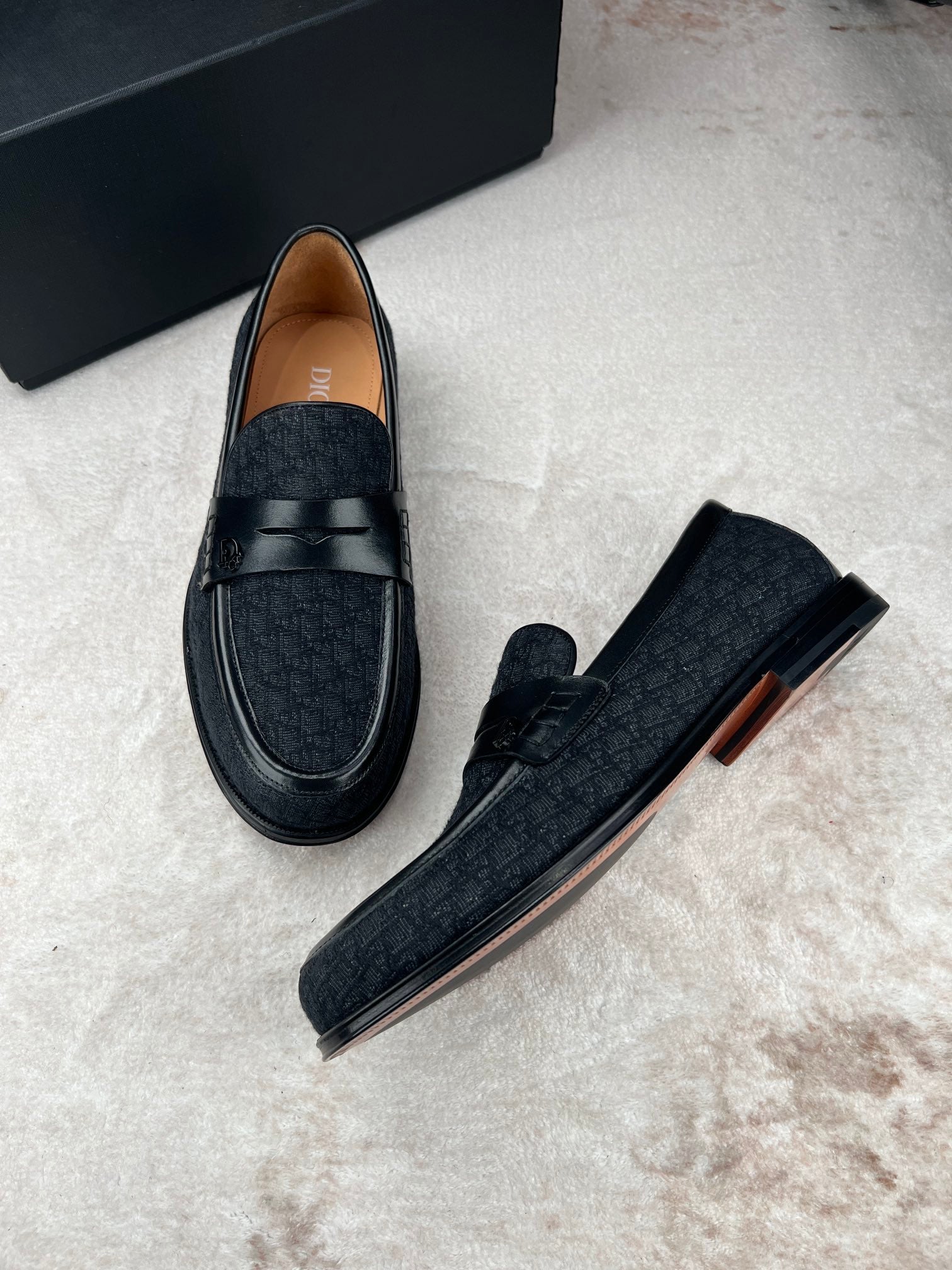 Black Dior unisex loafers, angled side view with strap