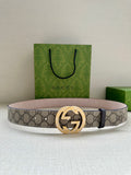 Gucci belt with beige GG canvas, dark leather trim, gold double-G buckle